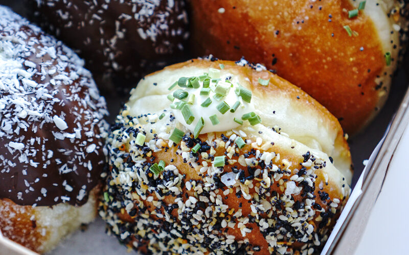 Everything Bagel Donut at mello Vancouver is a soft and fluffy brioche donut filled with a chive cream cheese filling