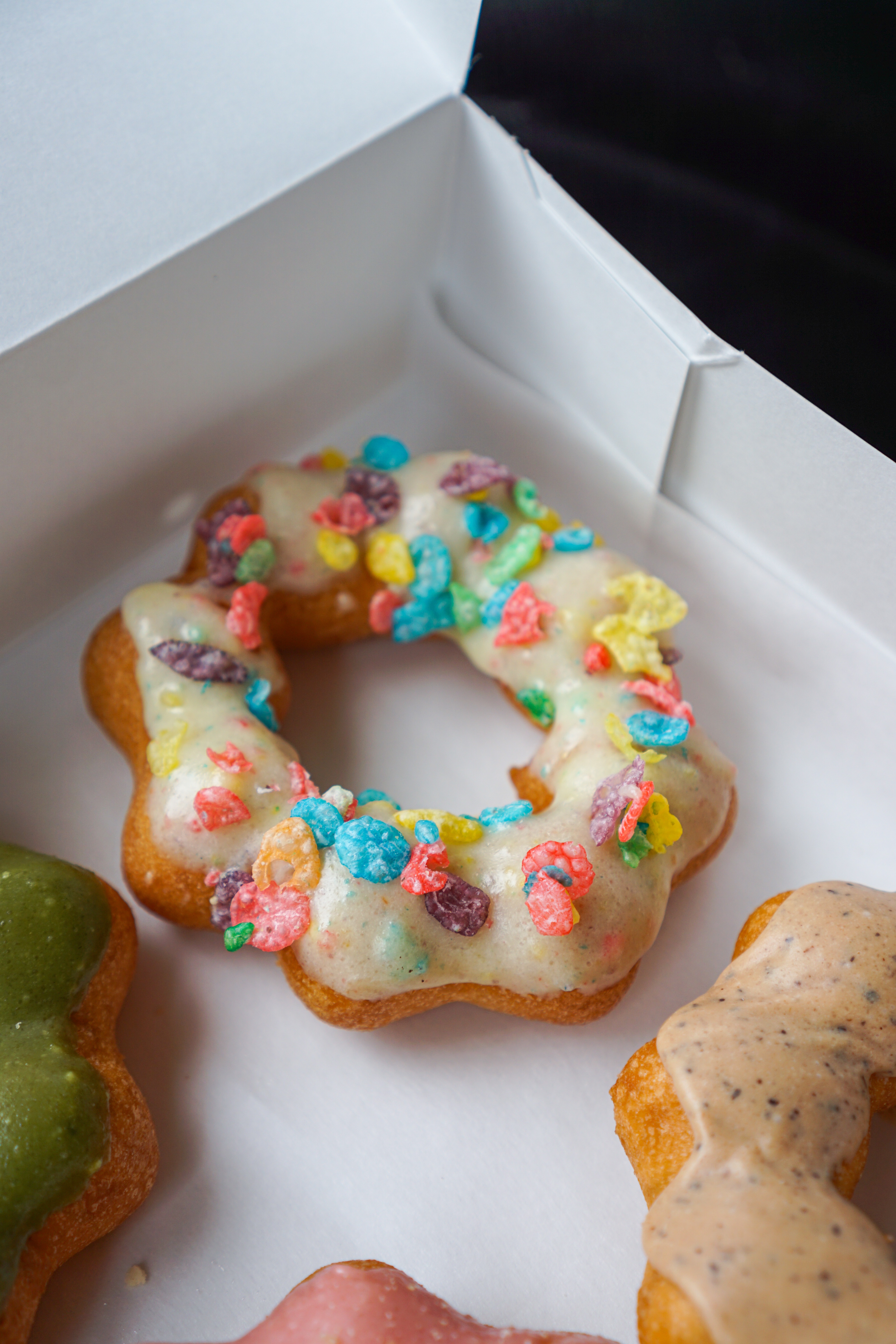 holy mochi donuts new spot for mochi donuts in metro vancouver colourful fruity pebbles on a milk white glaze mochi donut