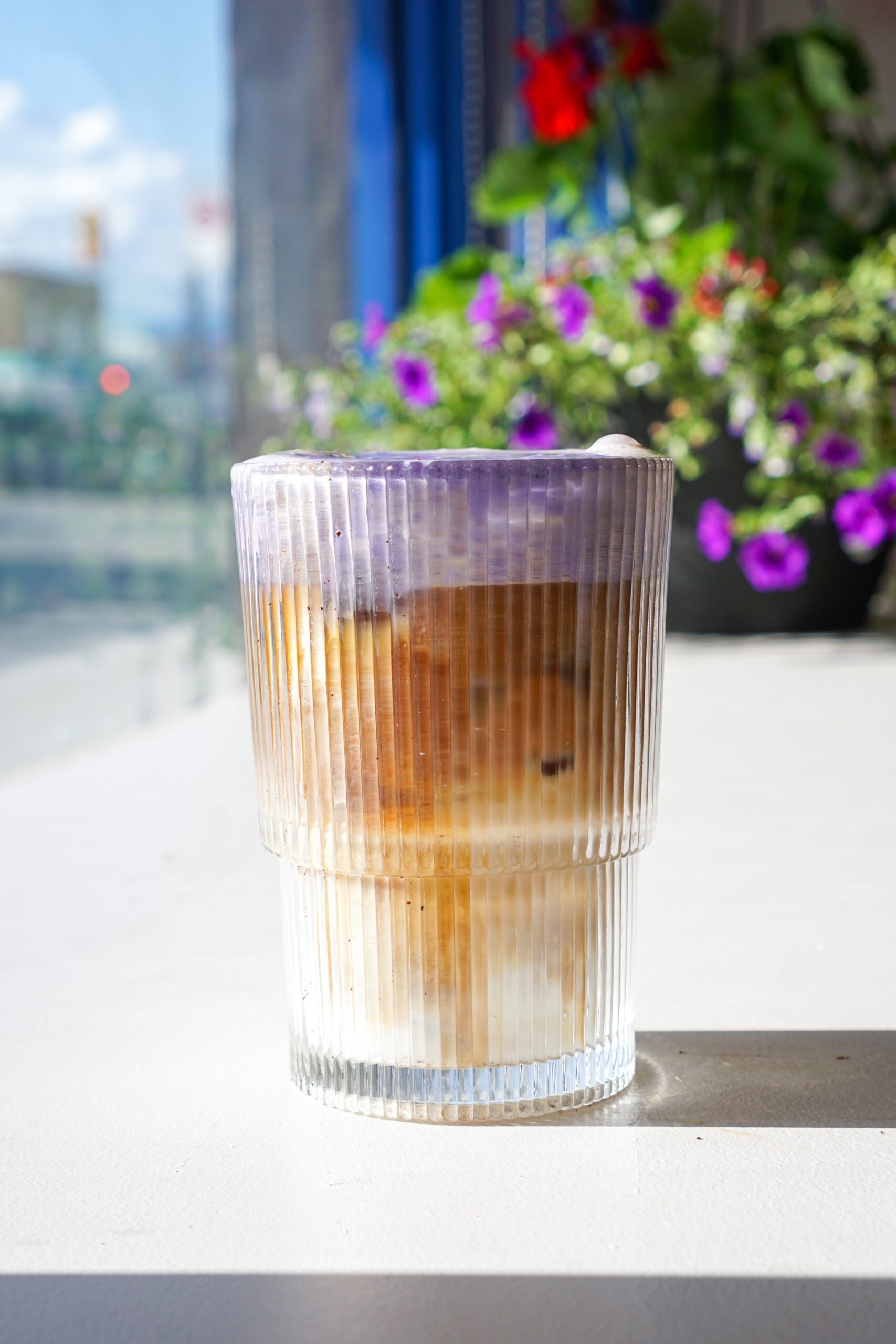 Hem 377 new vietnamese cafe on Victoria Drive in Vancouver ube latte with purple ube topping and coffee