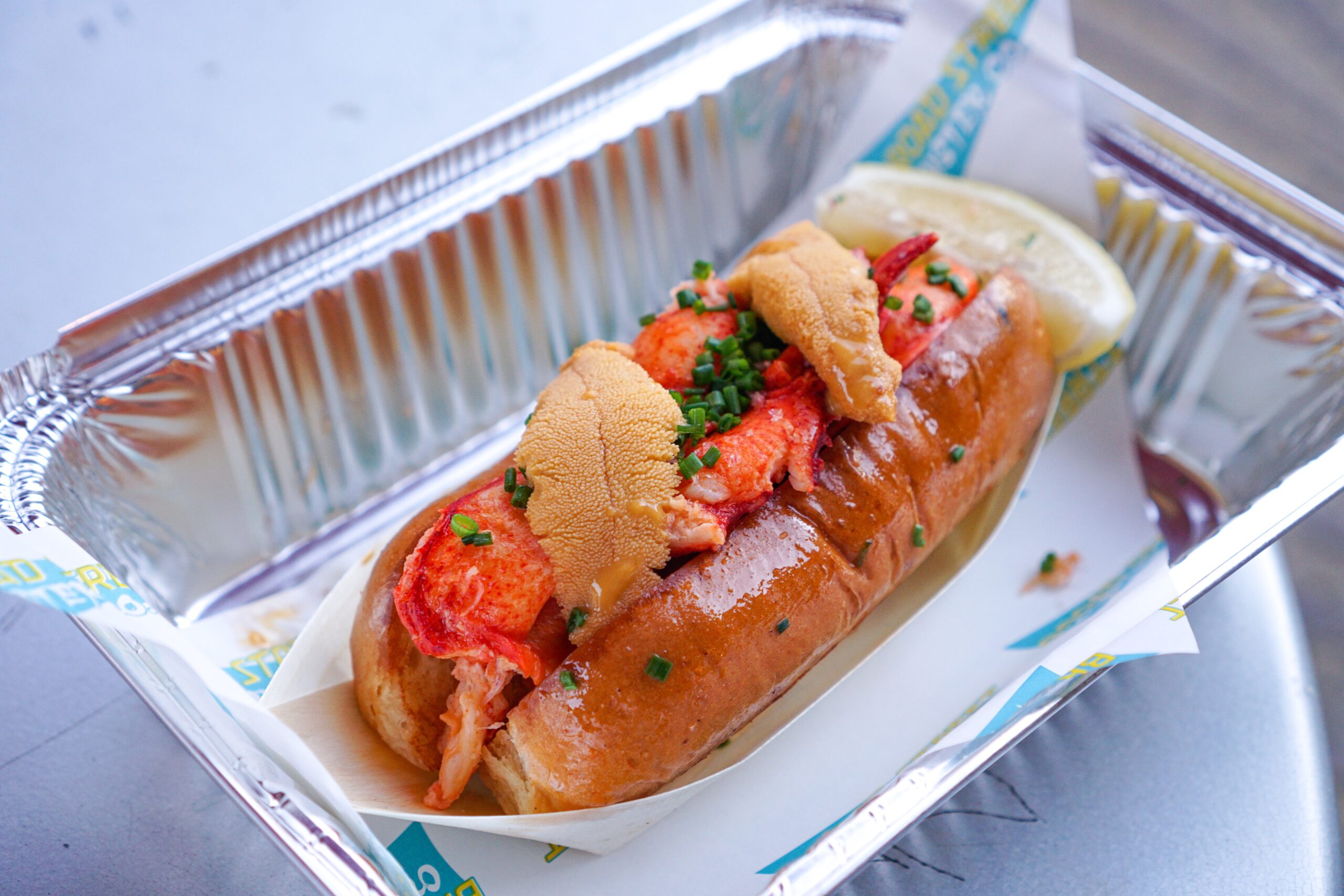 Broad Street Oyster Company - Must Try Lobster Roll in LA butter poached lobster in a toasted roll with chives and fresh uni