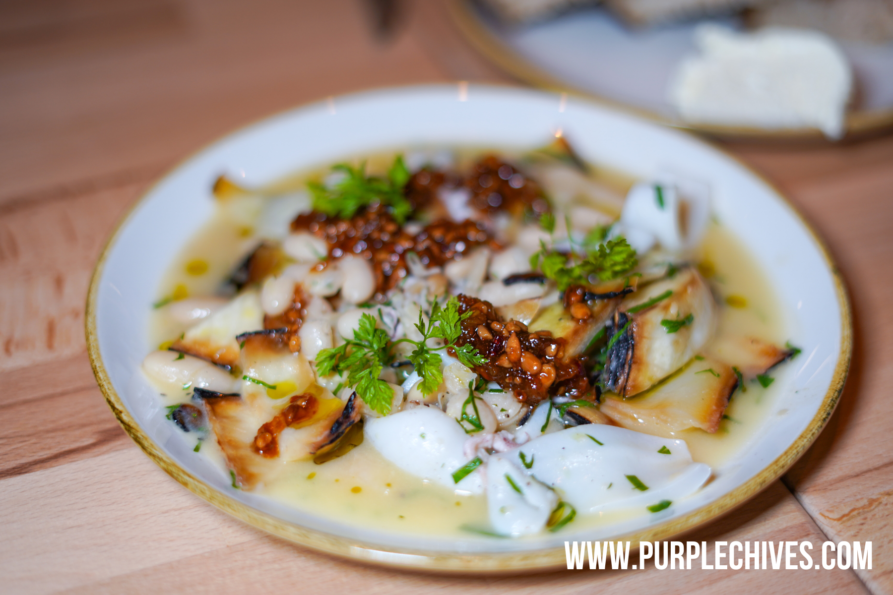 Ombre Tofino must try new restaurant in Tofino Marinated Calamari grilled cabbage, cannellini beans, agrodolce, wild bay 